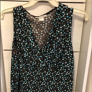 Sleeveless blouse with polka dots